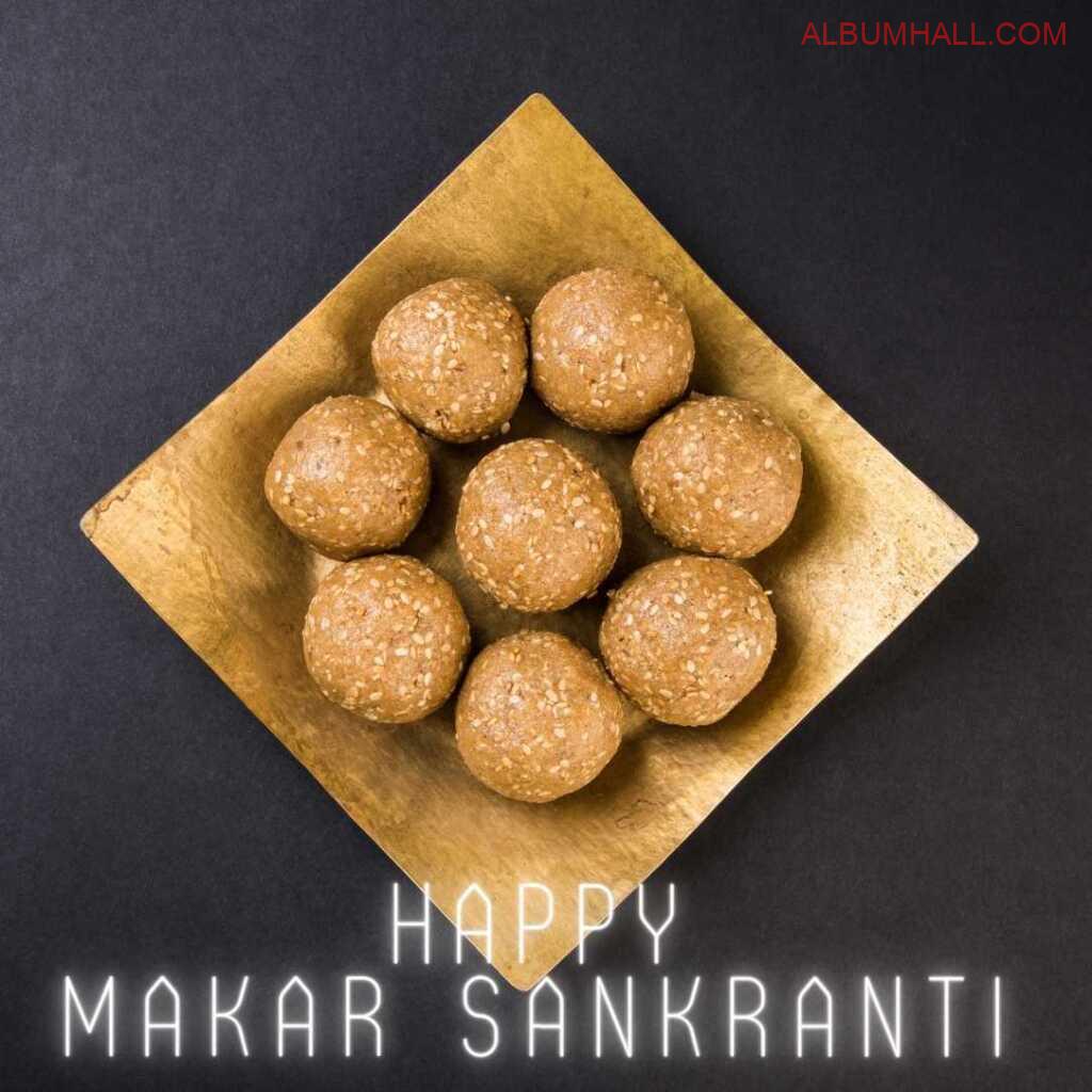 Golden square shaped tray filled with Sankrant ladoos on table