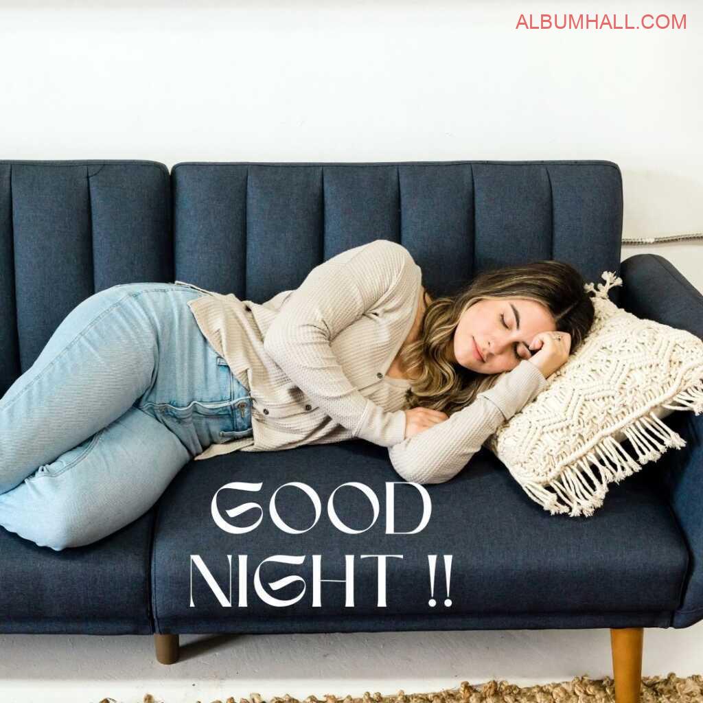 Girl wearing blue jeans and cream sweater sleeping on couch with cream color embroidary pillow