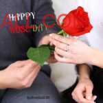 Blue color sweatshirt wearing man holding light red rose & giving to his women wearing diamond ring on occasion of Rose Day