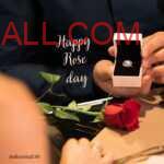 man holding a ring in a square box with red rose lying on table to wish her girlfriend Happy Rose Day
