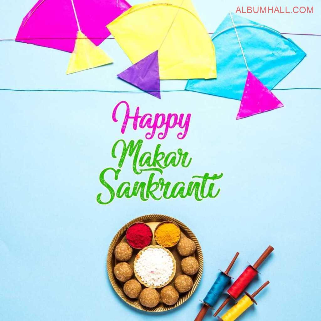 three Kites with thread and sweets plate wishing Makar sankranti in multi colored font
