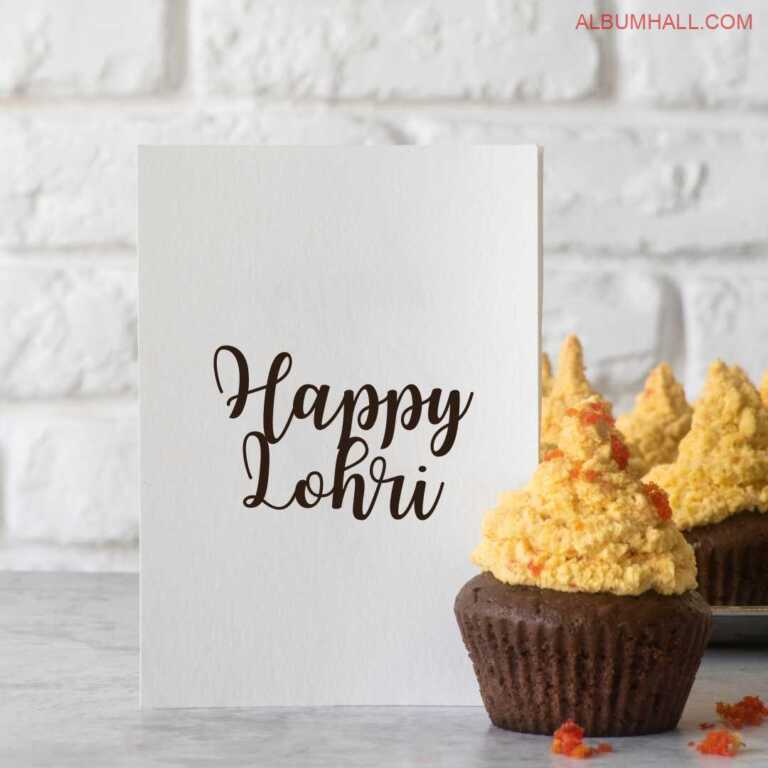 Happy Lohri note written on white paper with butterscotch and chocolate cupcakes