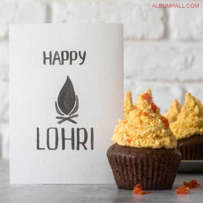 Happy Lohri note written on white paper with few drops of gajar halwa and three butterscotch & chocolate cupcakes