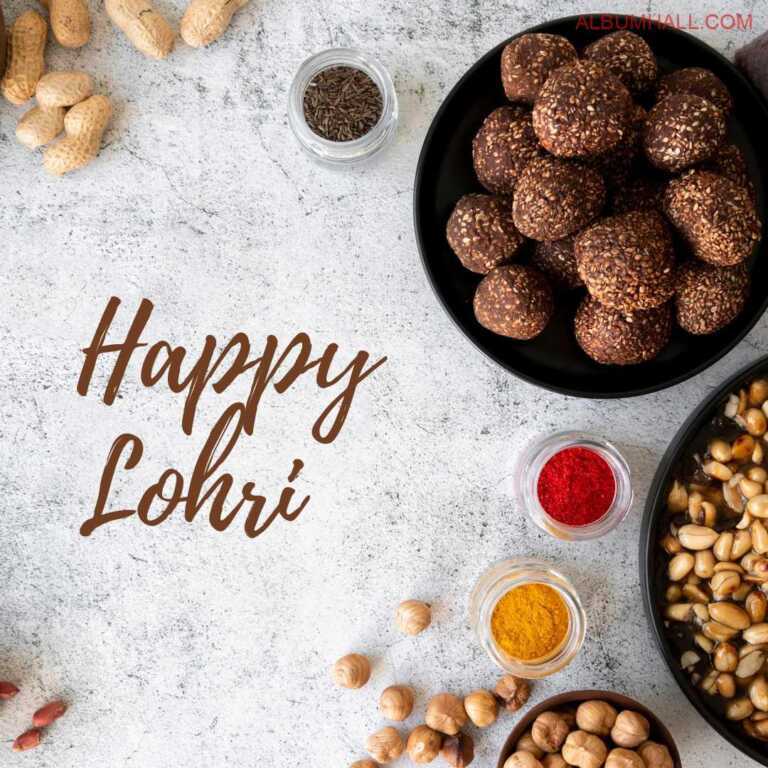 Lohri special peanuts, ladoos, chickpea and colors lying on white color table
