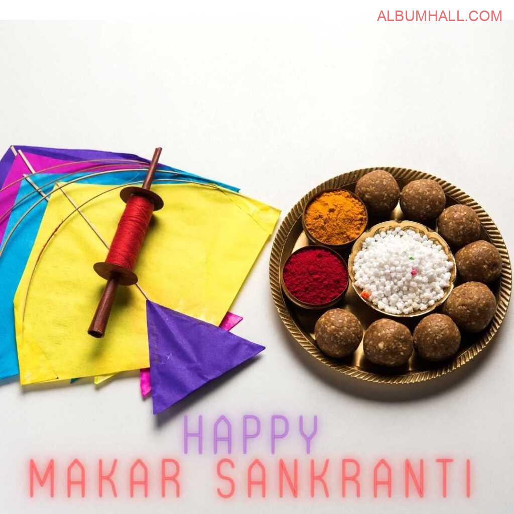 Makar sankrant wishes with colored kites, thread and sweets