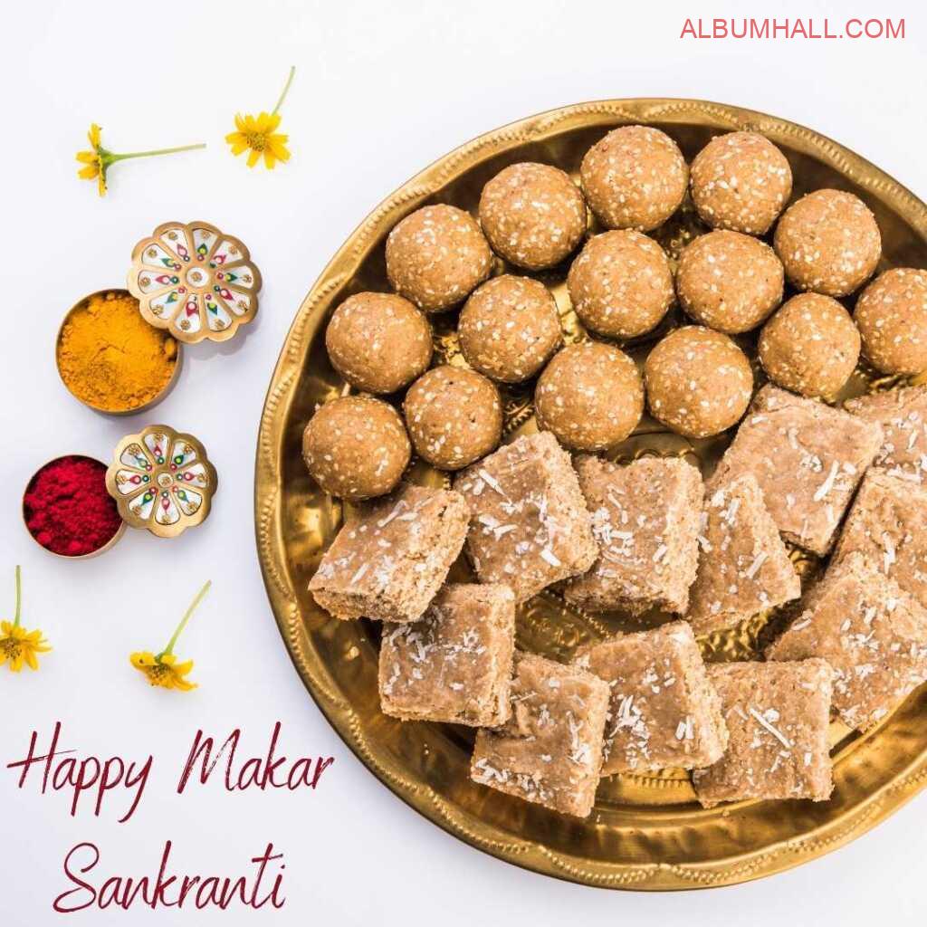 Sankrant special items like gachak, ladoo and colors in a big plate on a decorated table