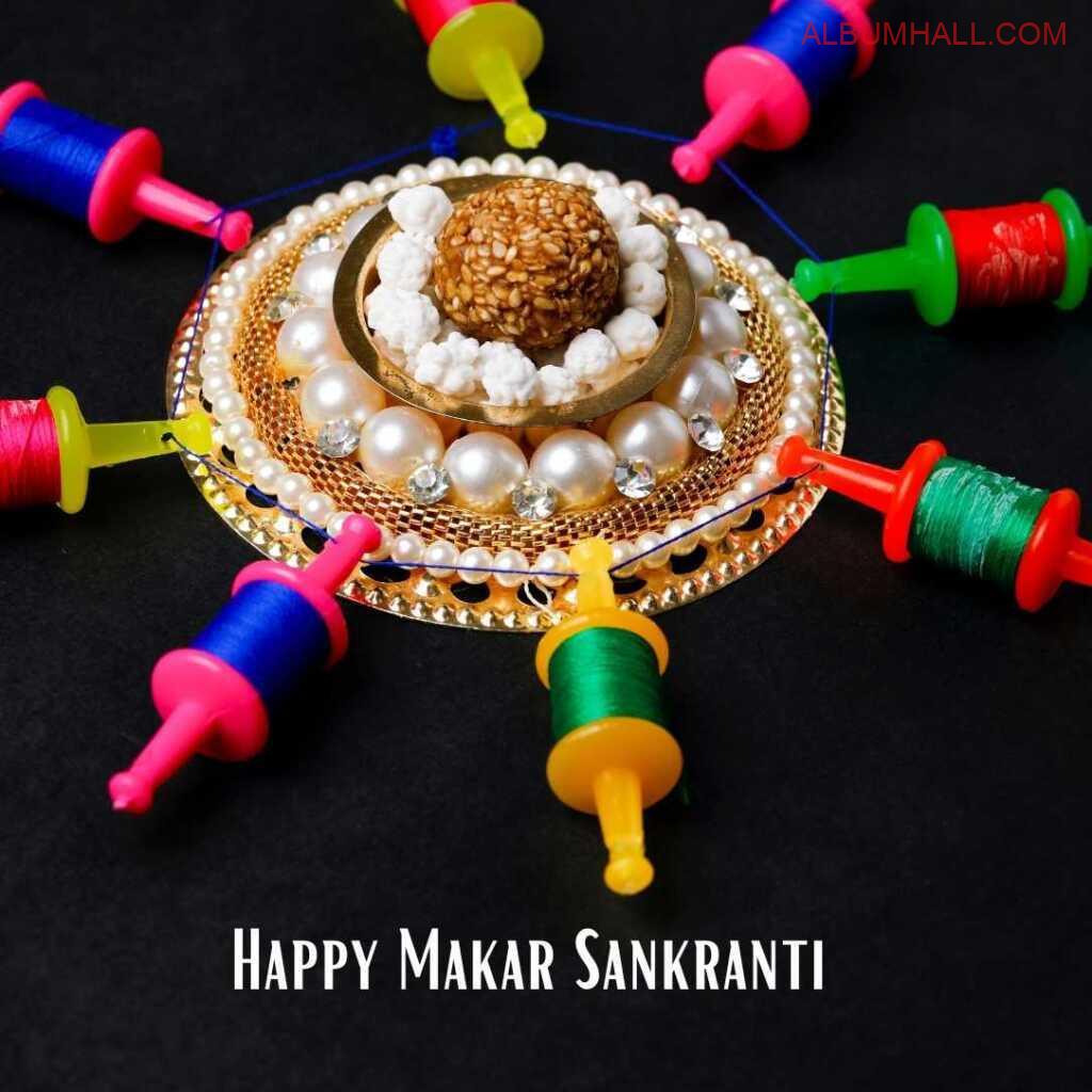 Sankrant ladoo in center surrounded by kite threads