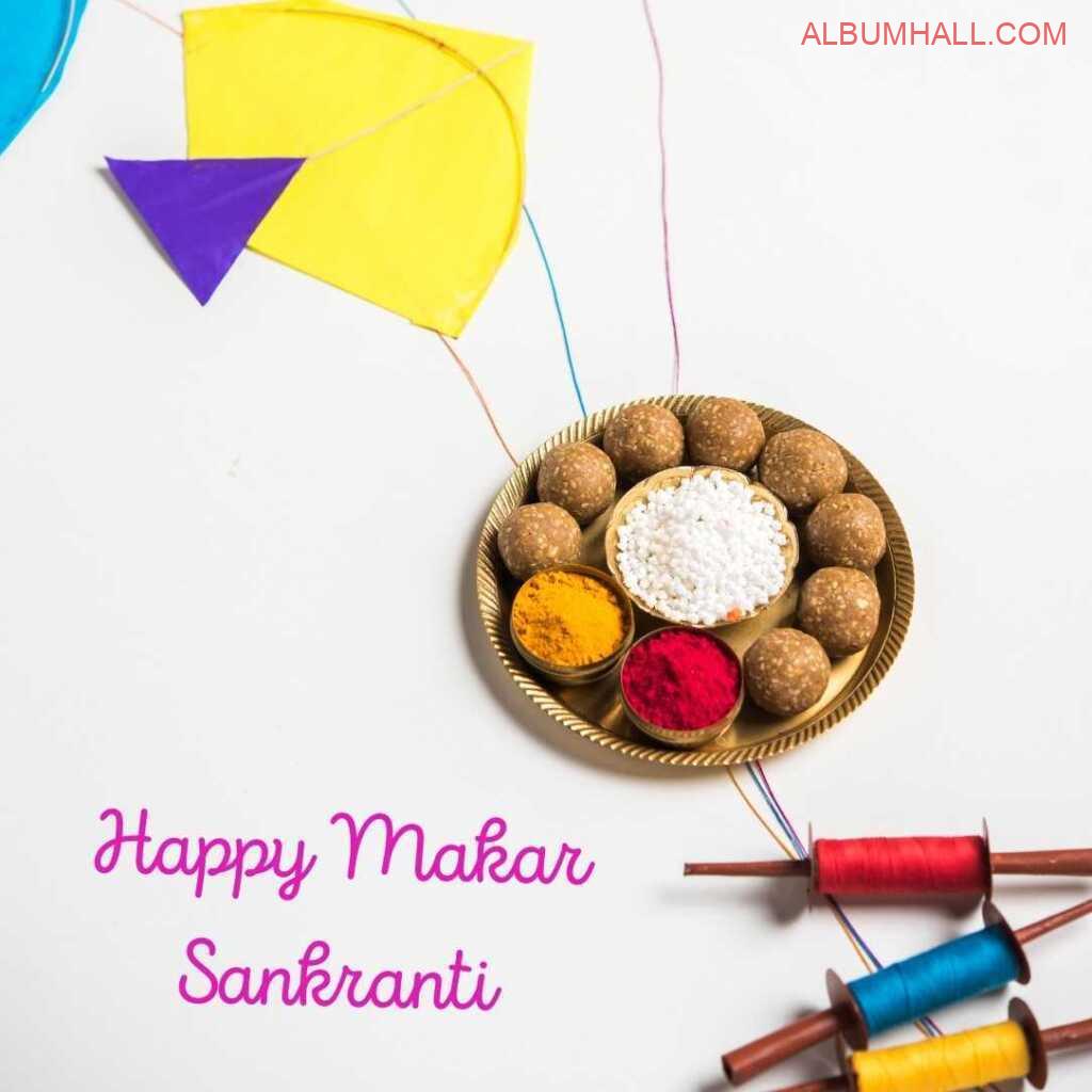 Sankrant yellow & blue kite with three threads and ladoos in a plate