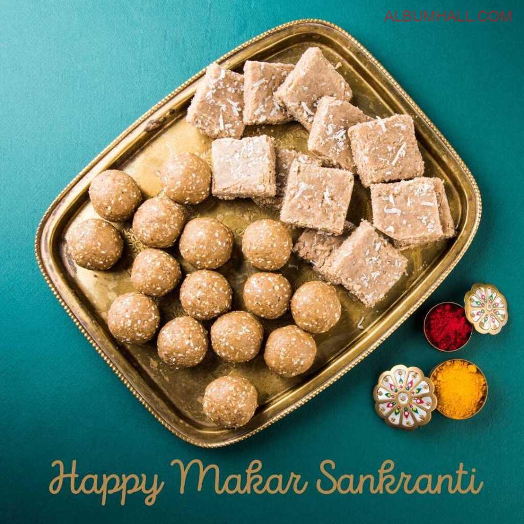 Sankrant special items like barfi, ladoo and colors on a decorated table