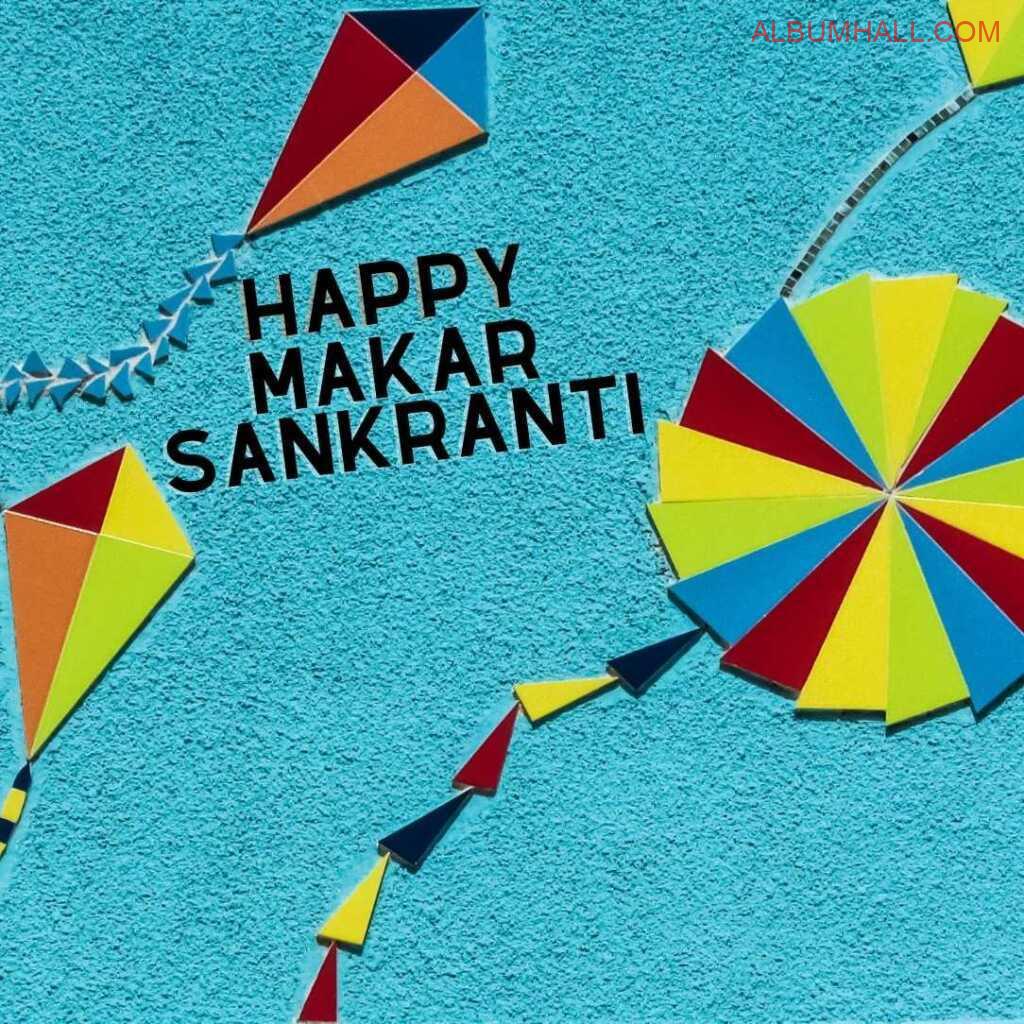 Sankrant kites and wheel chakra made of colored papers on table with blue background