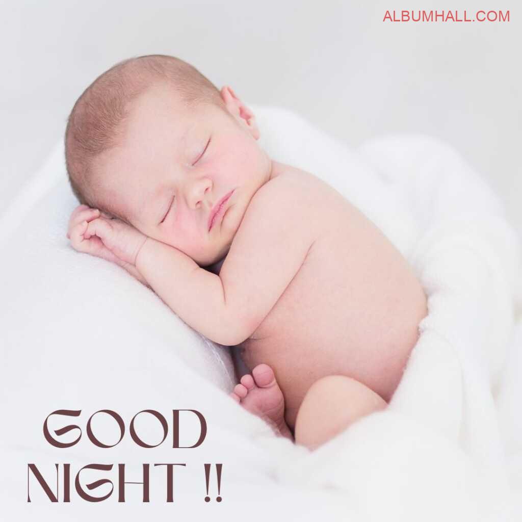 Infant cute baby sleeping and wishing good night in his white pampering towel