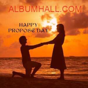happy propose day my love - boy proposing to his girl kneeling down with ring on sea shore under evening sky