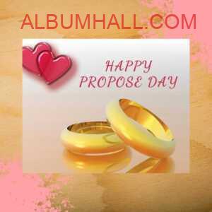 Golden two rings and pink heart to wish happy propose day