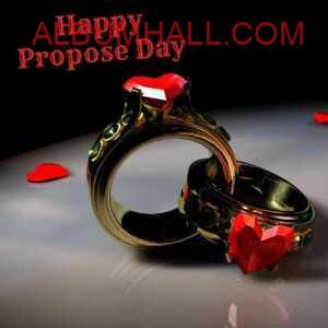 gold diamond rings with heart shaped stone on table wishing Happy propose day