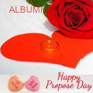Rose with red heart and sleek ring on it wishing happy propose day and asking to say yes