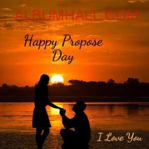 happy propose day my love - boy proposing to his girl kneeling down on sea shore in the evening