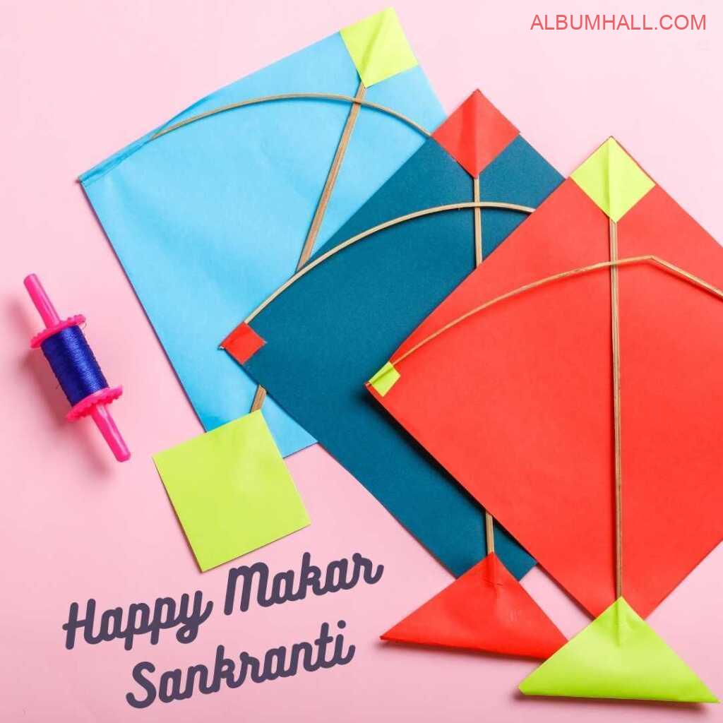 pink mat with three kites and a blue thread on sankrant