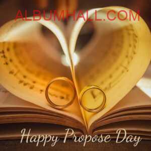 two rings on book pages making heart shape on propose day