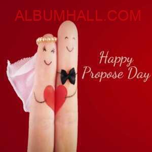 two fingers with heart and black bow on it for propose day