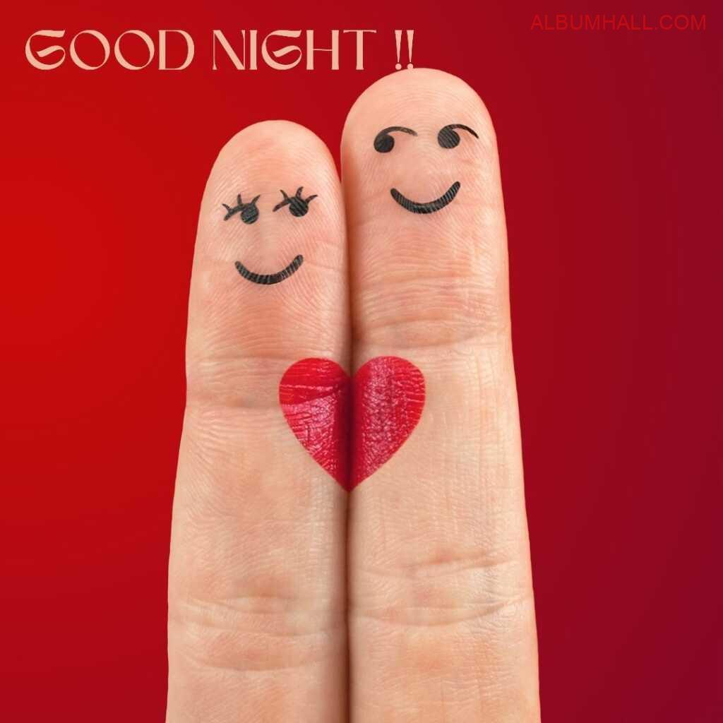 red background with two fingers with smileys and heart when joined together wishing a very good night