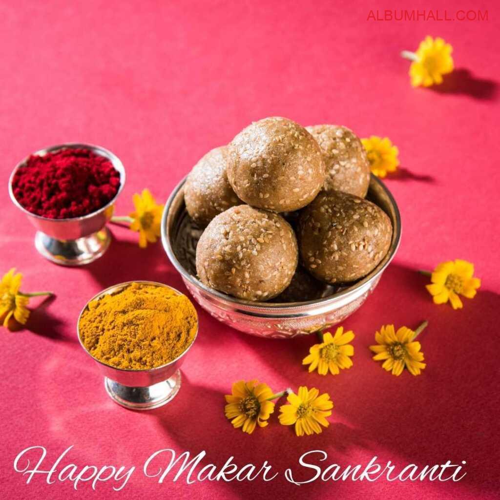 yellow flowers spread across with Sankrant ladoos and colors around