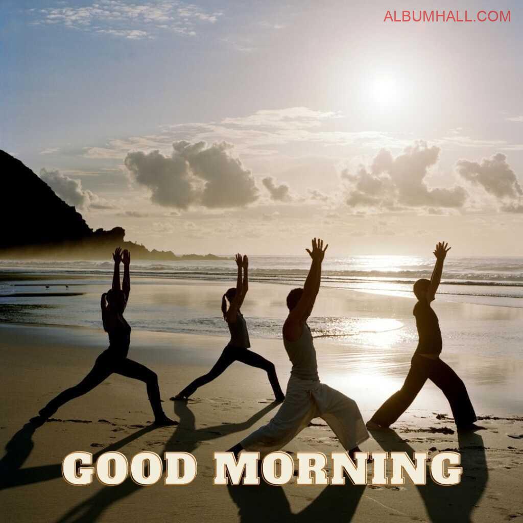 group of four people performing yoga on beach side early morning